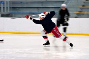 Hockey player takes slap shot