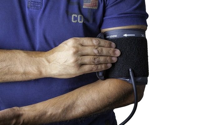 man taking his blood pressure physiotherapy cardiovascular disease CVD